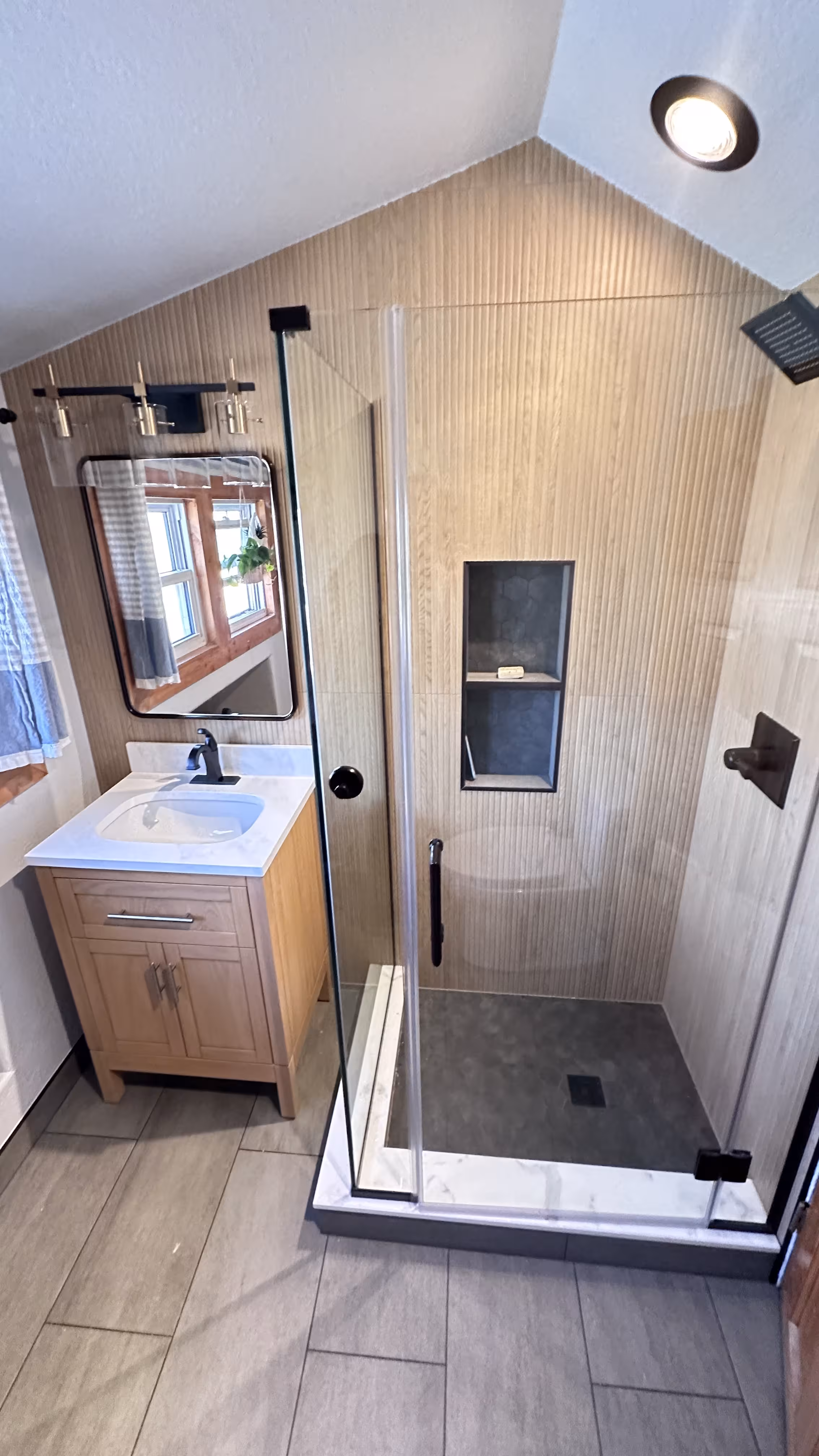 Shower fixture installation during Denver bathroom remodel