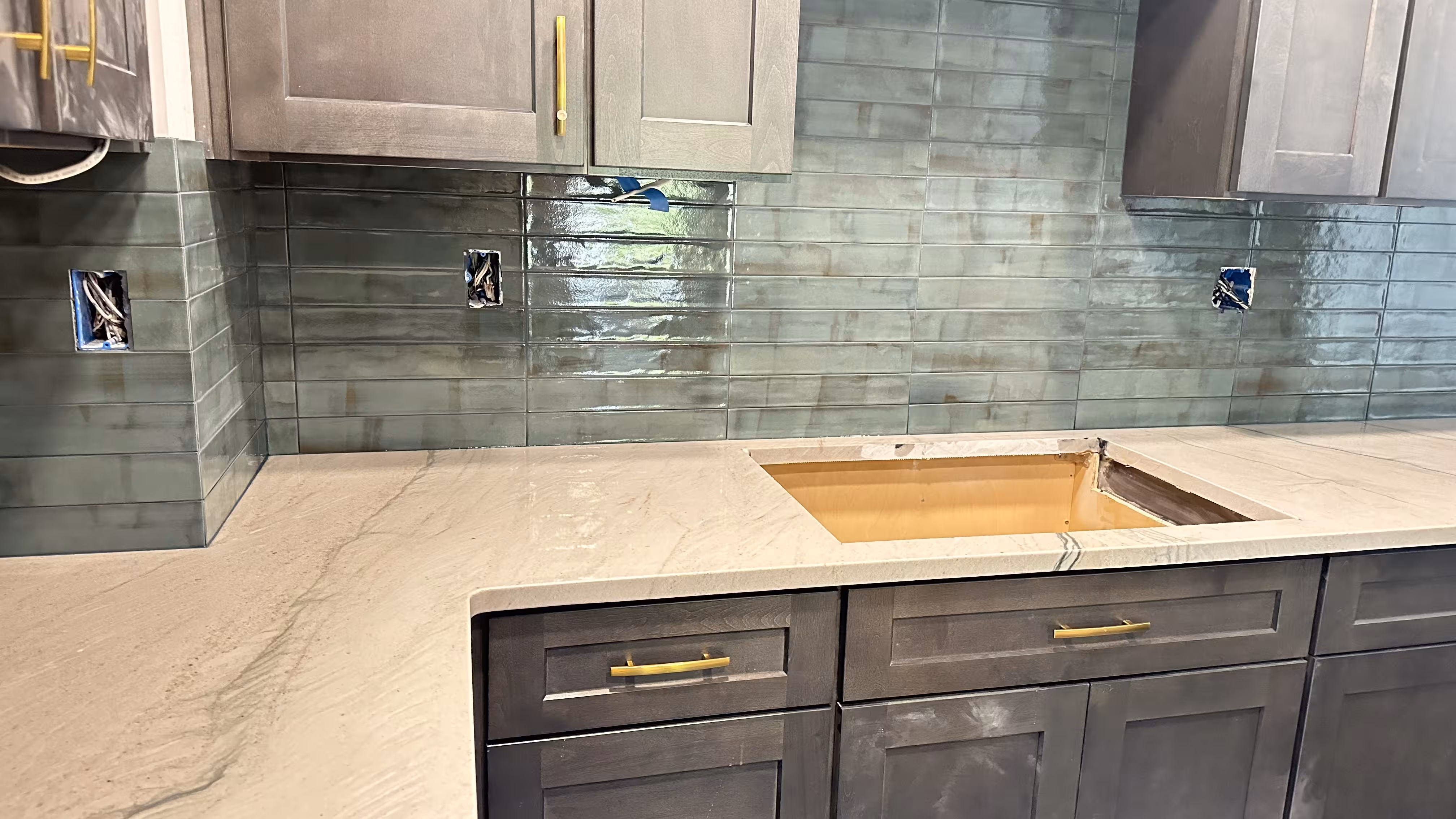 Subway tile installation progress for Aurora kitchen backsplash