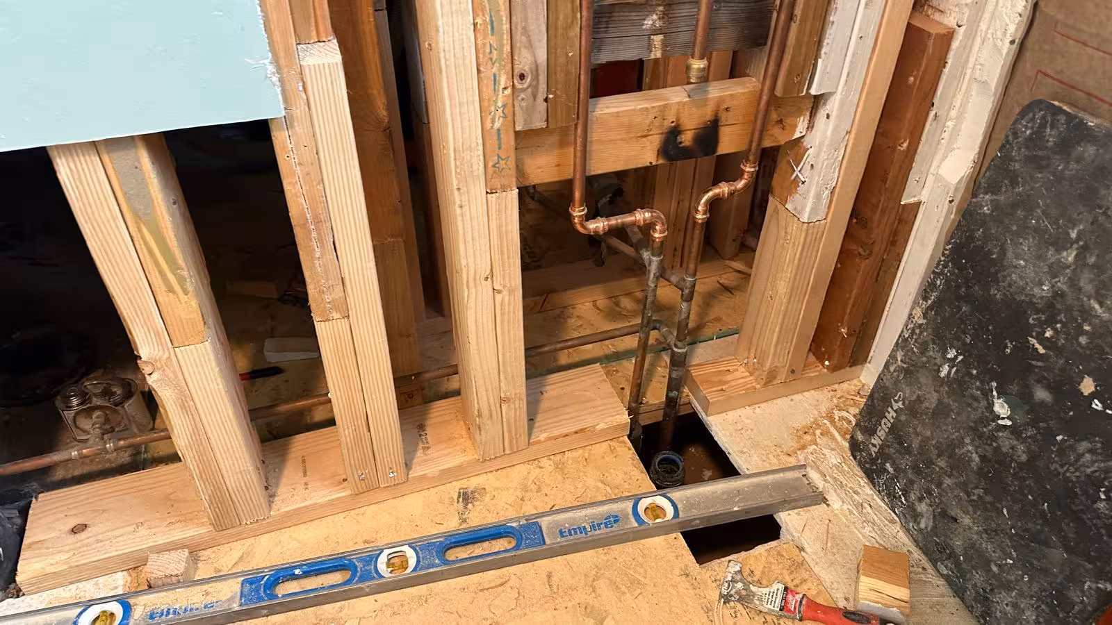 New shower wall framing and bottom plate repair after rot removal in Arvada bathroom remodel