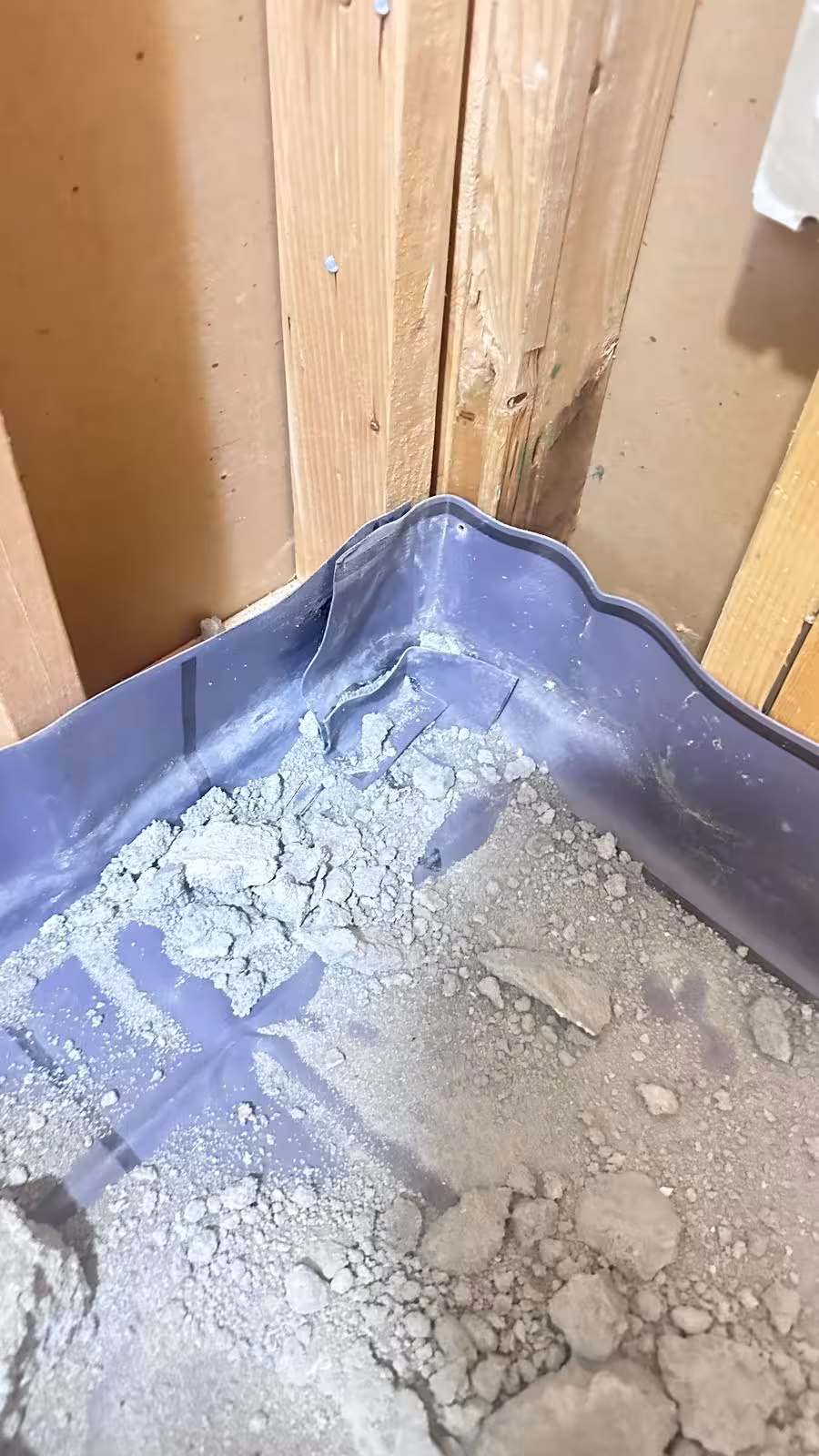 Crumbling mortar and faulty liner corner in Denver shower pan