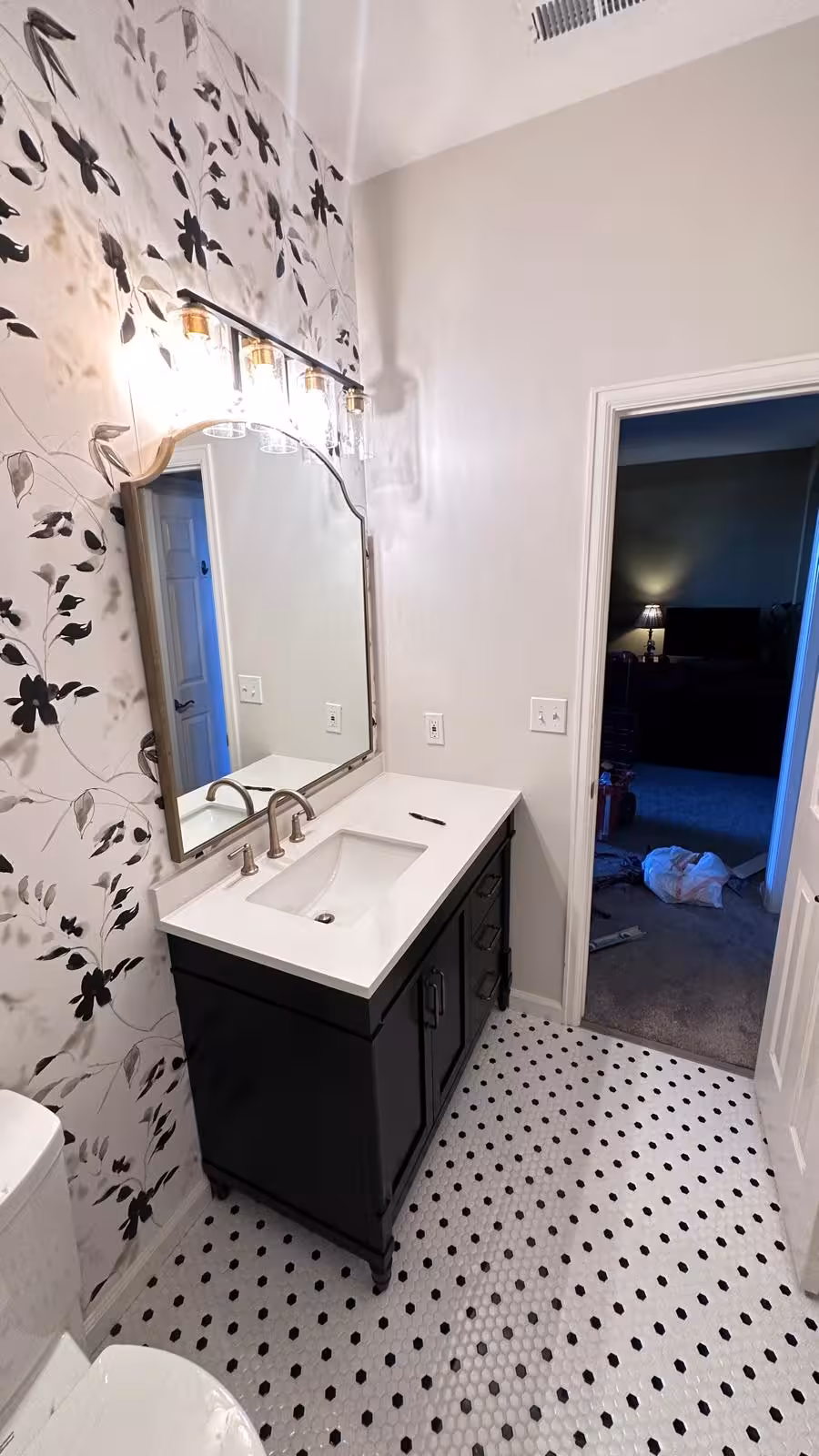 Wallpaper and mirror detail in finished Aurora designer bathroom remodel