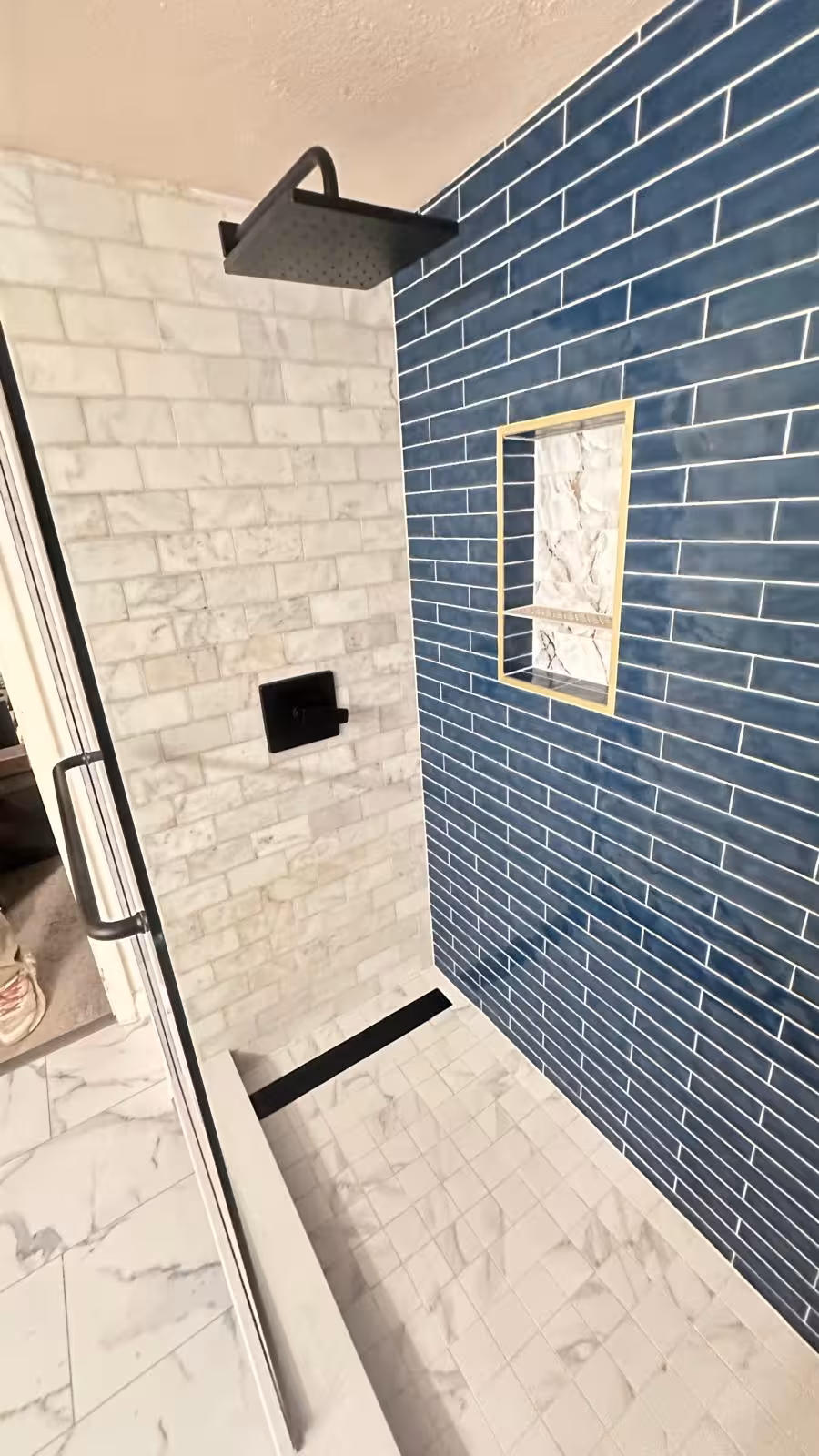 Complete walk-in shower transformation with blue and white tile design linear drain basement remodel Aurora
