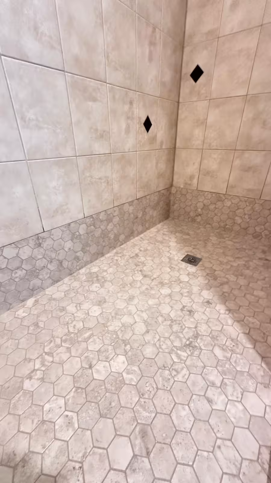 Shower wall tile with hexagon accent detail after complete renovation Elizabeth Colorado