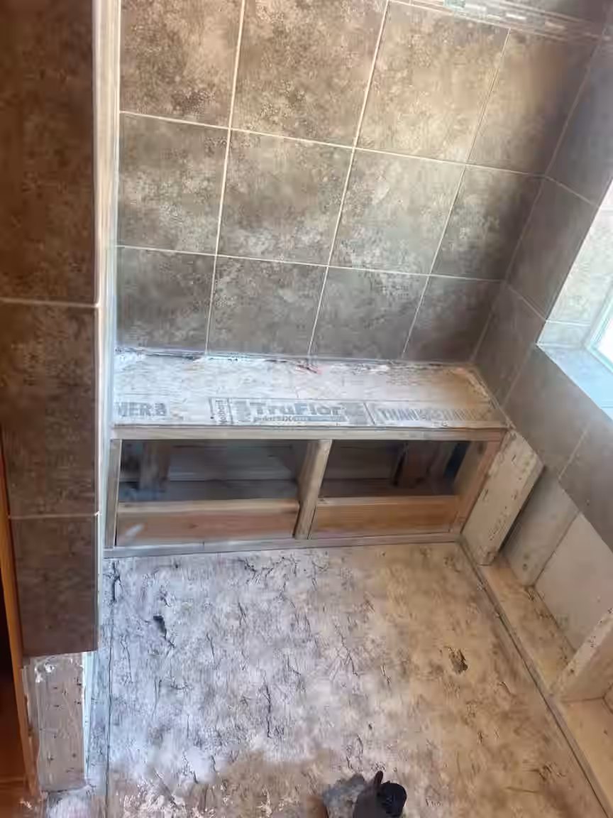 New shower floor wood frame construction after replacing rotted subfloor