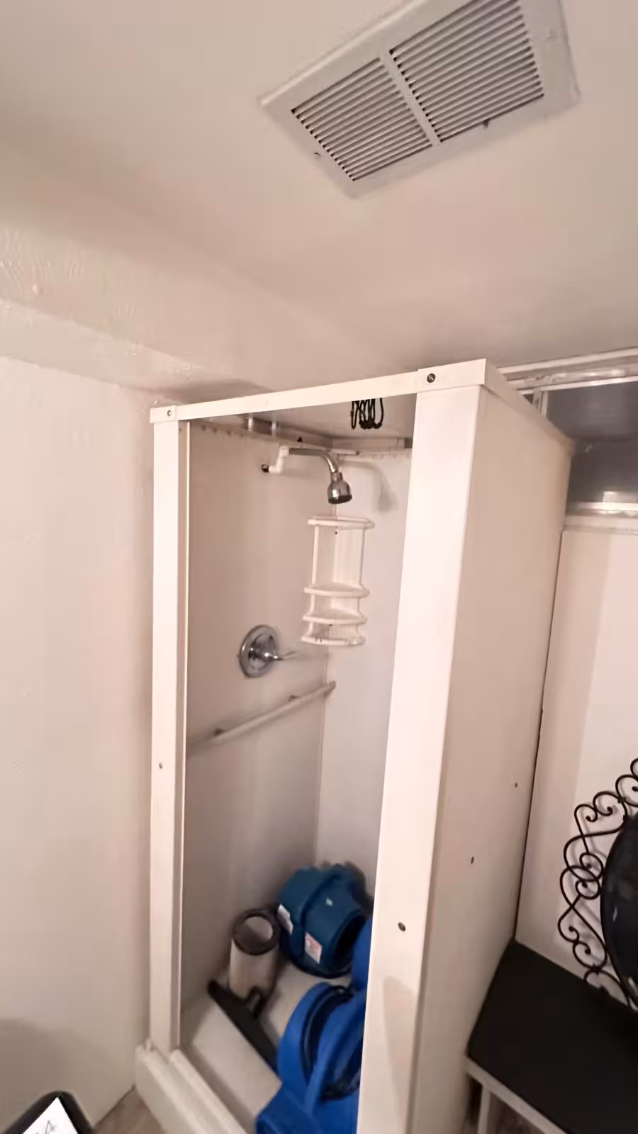 Old plastic fiberglass shower stall before demolition Littleton basement