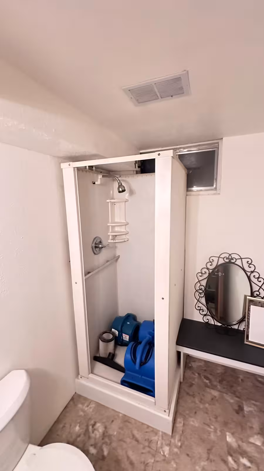 Outdated shower enclosure before replacement Littleton basement bathroom