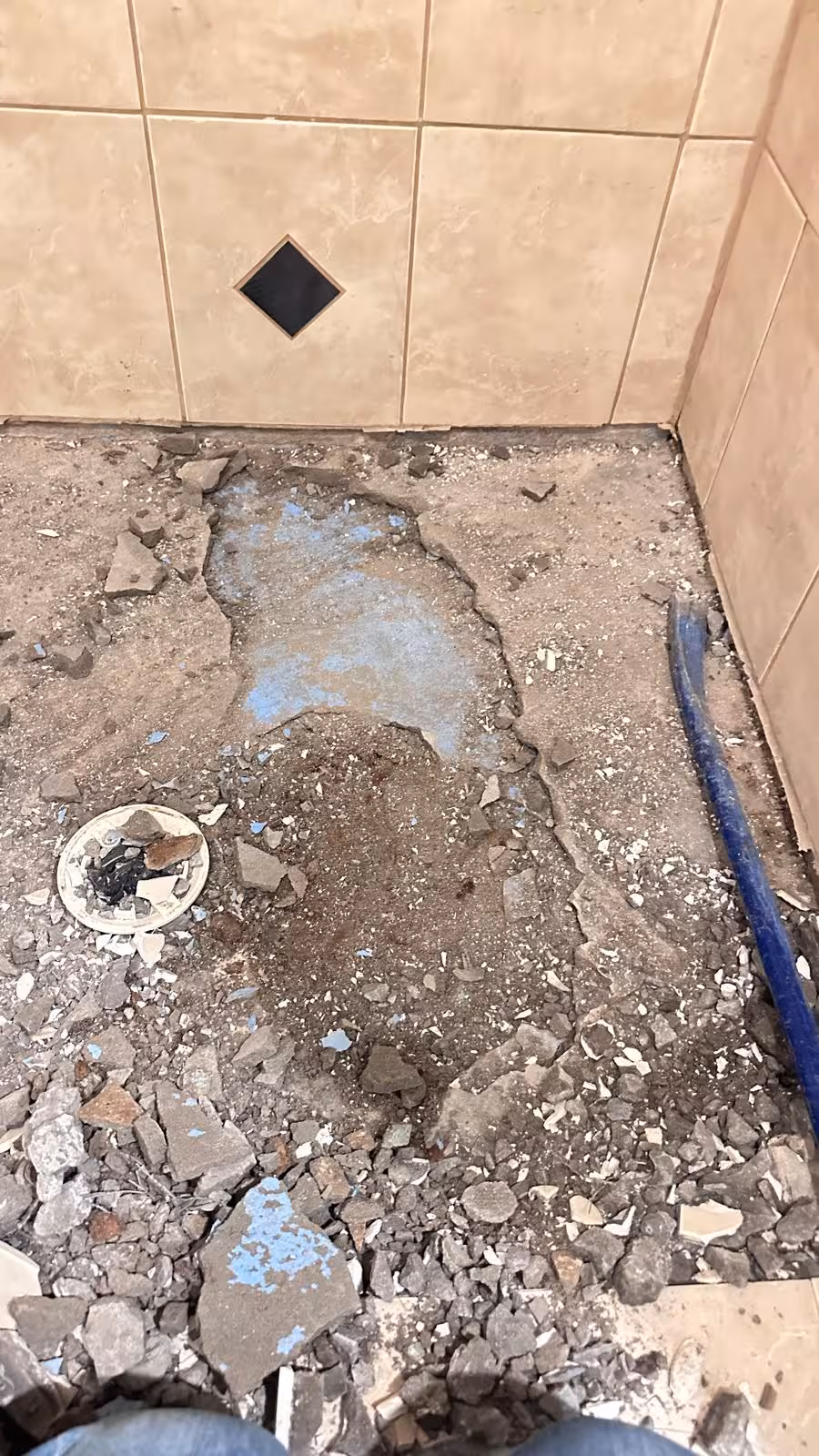 Damaged shower pan base removal showing failed waterproofing system Elizabeth Colorado