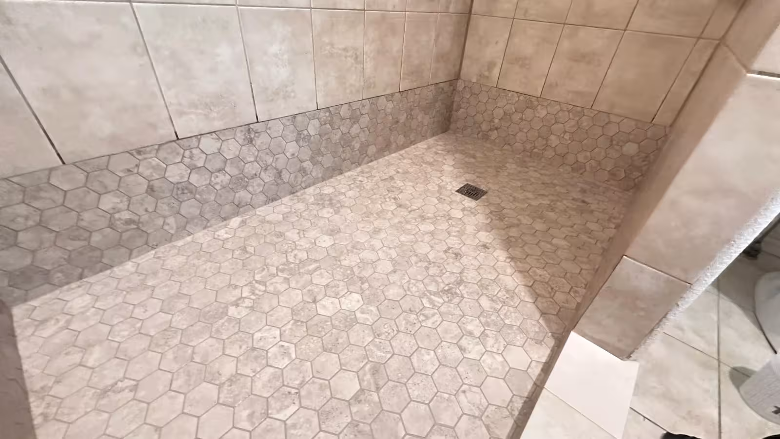 Completed shower floor with hexagon mosaic tile after pan reconstruction Elizabeth Colorado