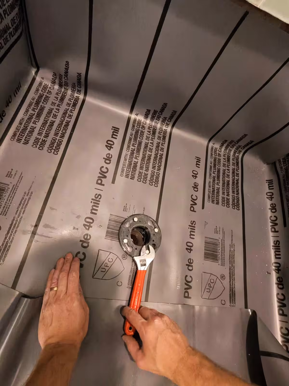 Installing shower drain flange with clamping ring on PVC liner Denver